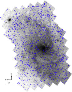Spatial distribution of PHATTER star clusters (blue) overlaid on a F475W survey-wide mosaic image.