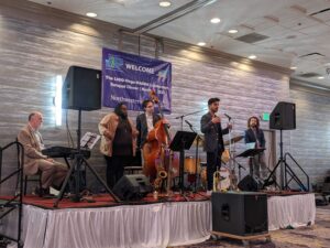 Darsan Swaroop Bellie introduces the five-piece jazz band performing at the networking event