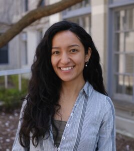 Headshot of Monica Gallegos-Garcia in front of a building