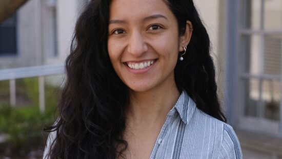 Headshot of Monica Gallegos-Garcia in front of a building